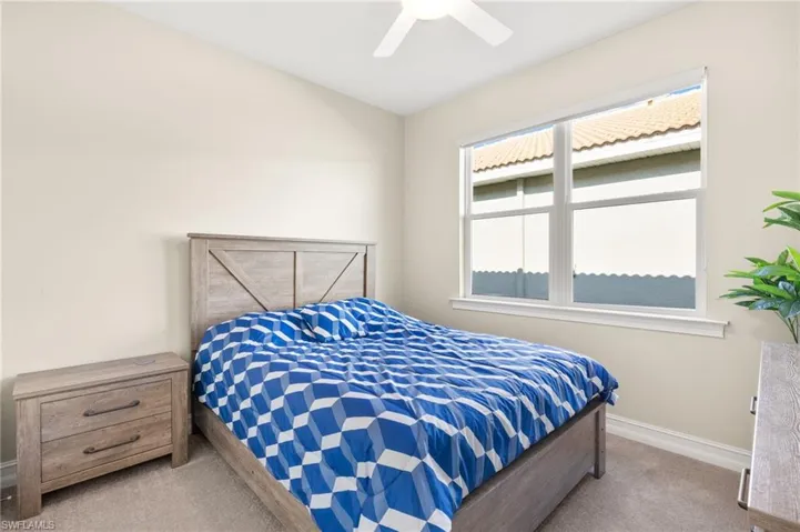 Bedroom featuring carpet and a ceiling fan