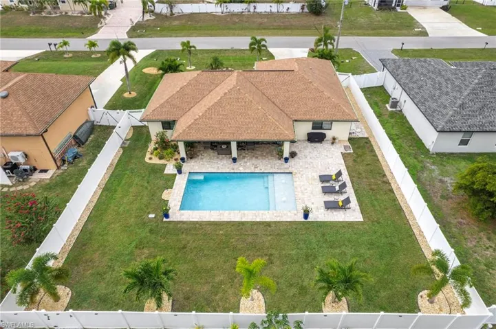 View from above of property with a pool area