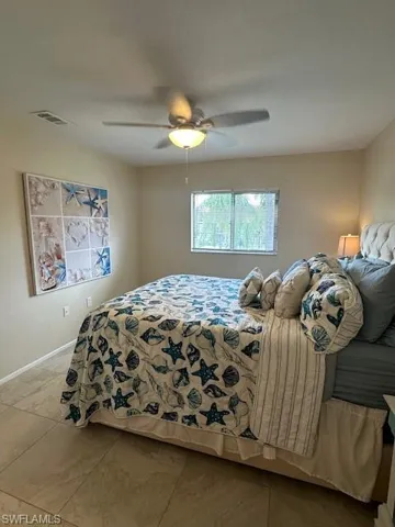 Master bedroom featuring ceiling fan