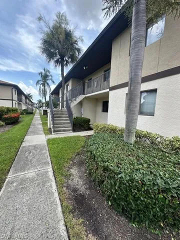 View of sidewalk leading to condo