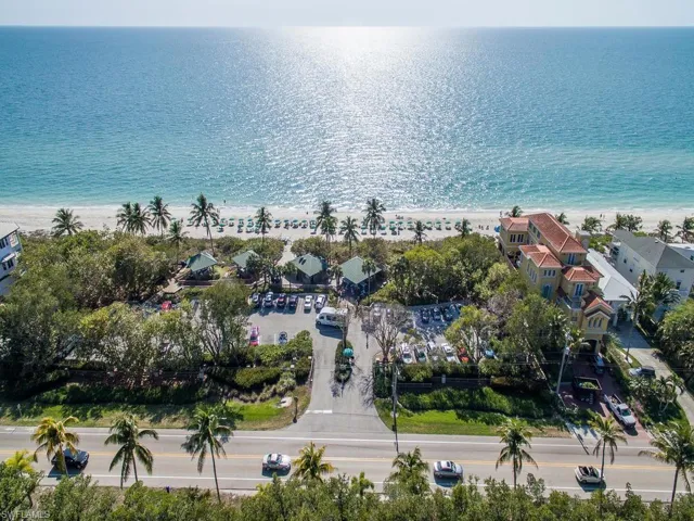 Drone / aerial view featuring a view of the beach and a water view
