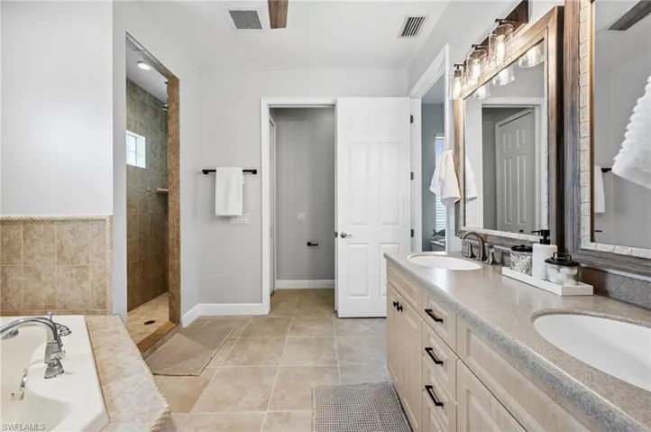 En-Suite Primary Bath - New Custom Mirrors, Lighting & Fixtures. Enormous Shower With Dual Shower Heads! Walk-In Closet & Large Linen Closet!