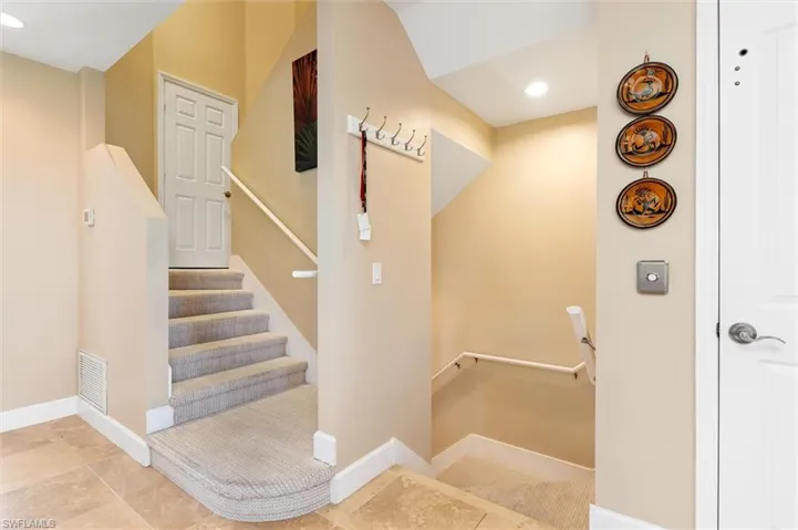 Staircase featuring recessed lighting and baseboards