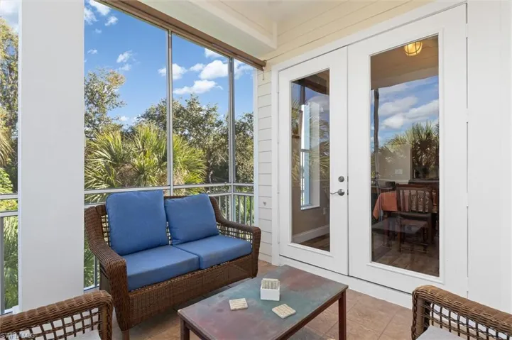 Sunroom / solarium with french doors and tile patterned floors