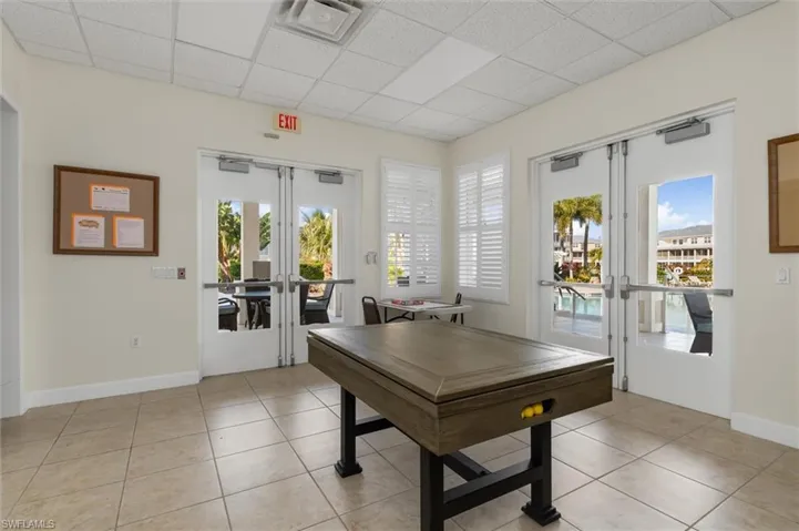 Playroom featuring french doors and a paneled ceiling