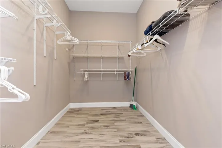 Walk in closet featuring light wood finished floors