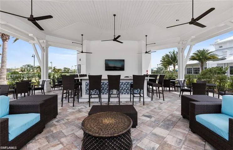 View of patio / terrace with exterior bar and ceiling fan