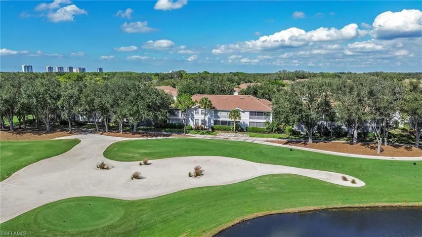 View of home's community featuring golf course view, a water view