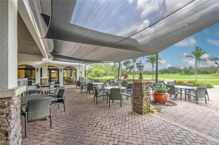View of patio featuring outdoor dining space and view of golf course