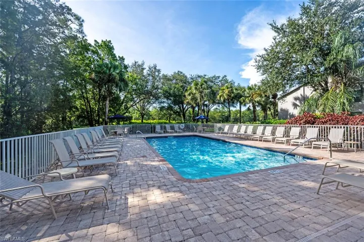 Community pool featuring a patio