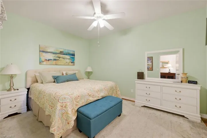 Bedroom with ceiling fan and baseboards