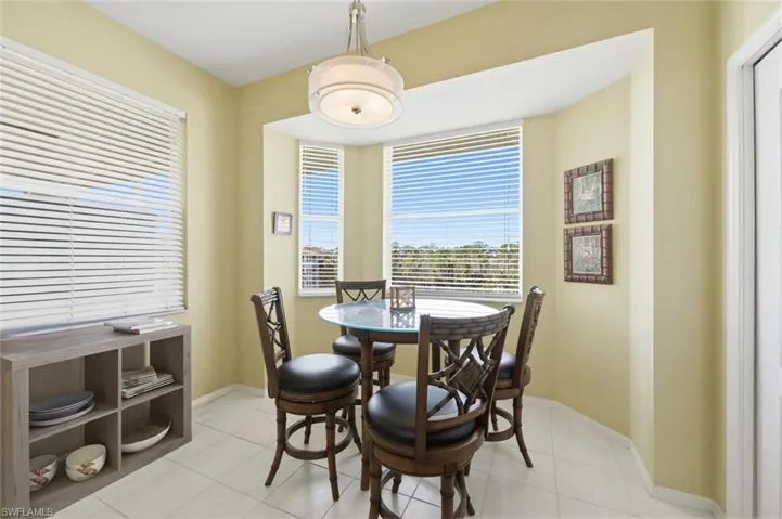 Dining area featuring baseboards and light tile patterned flooring