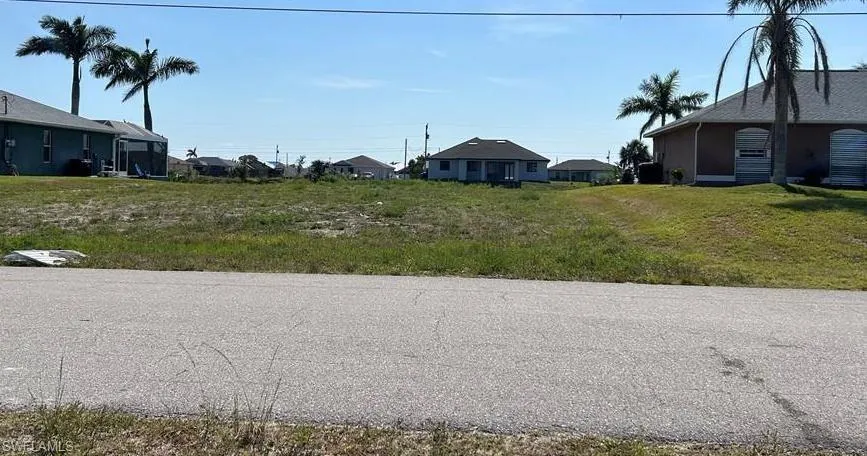 View of asphalt street with a residential view