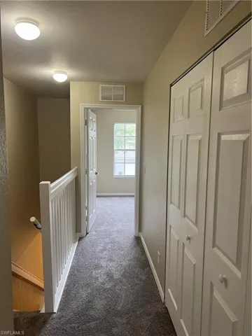 Hall with carpet flooring