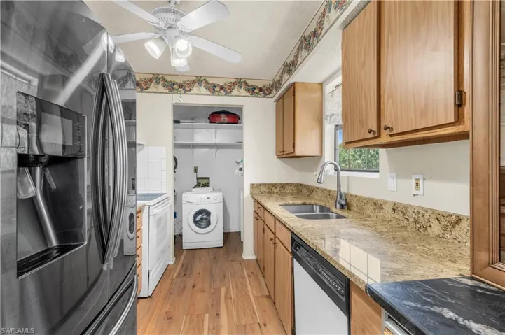 Kitchen w/ graniteLaundry Room in rear