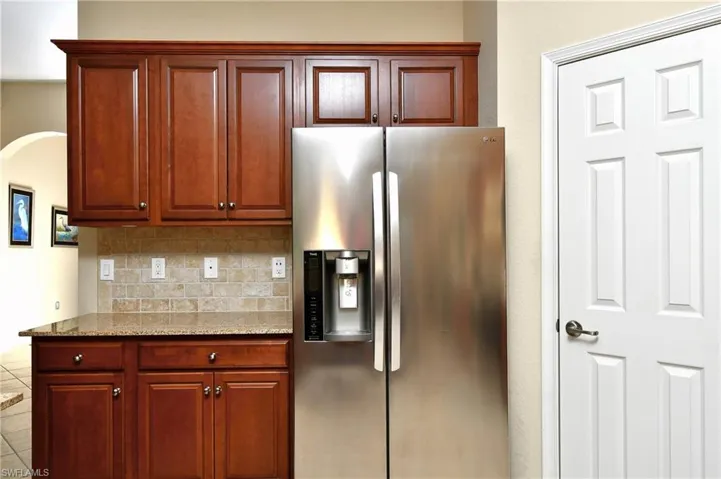 Plenty of cabinets and counter space with a walk-in pantry with built in California closet shelving