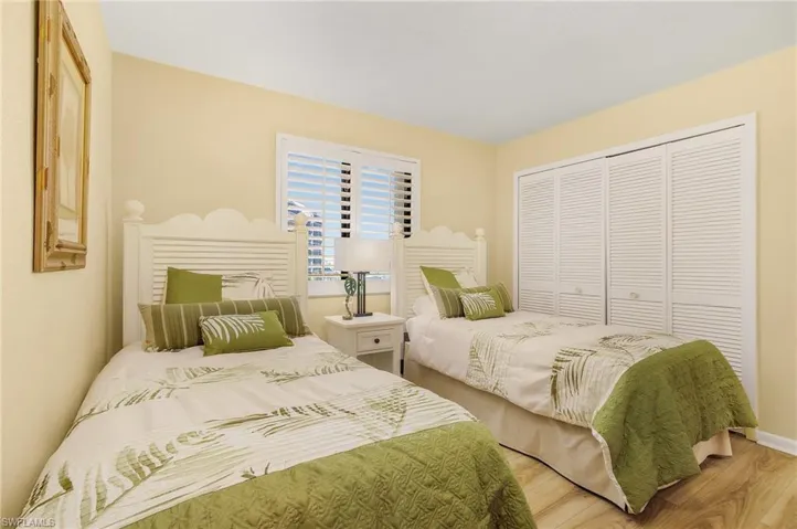 Bedroom featuring hardwood / wood-style flooring and a closet
