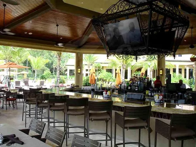 View of patio with a gazebo and an outdoor bar