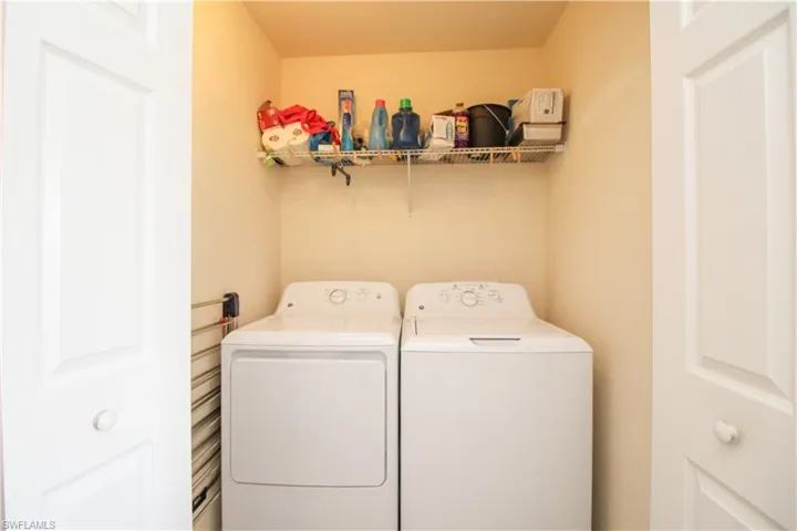Clothes washing area with washing machine and clothes dryer