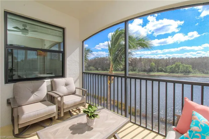 Sunroom with a water view
