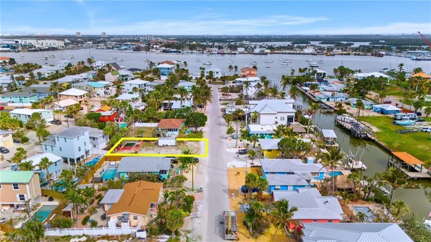 Birds eye view of property with a water view VIRTUALLY EDITED