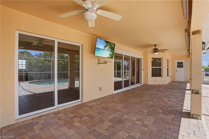 Large Covered Lanai - Patio door to Left leads to Primary Bedroom