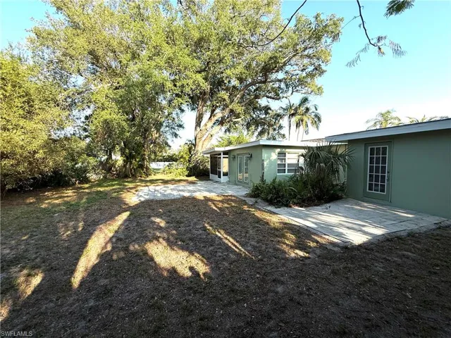 Rear view of house with stucco siding