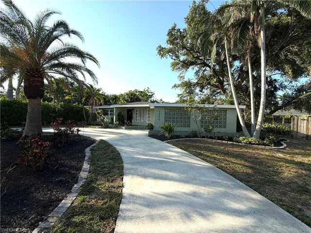 View of front of property with concrete driveway and stucco siding