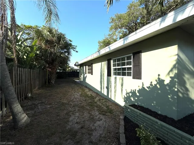 View of property exterior featuring stucco siding and a fenced backyard
