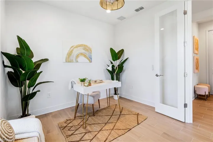 Office/Den area featuring light tile flooring with French Doors