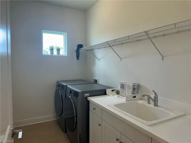 2nd Bedroom with tile flooring, walk in closet and ceiling fan
