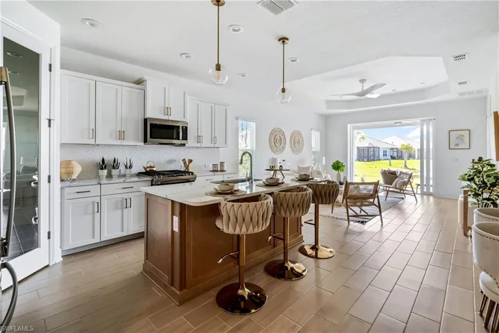 Kitchen featuring white cabinetry