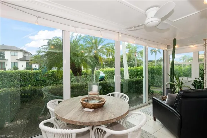 Sunroom / solarium with tile patterned floors