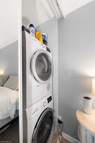 Laundry area featuring stacked washer / dryer