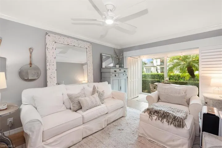 Living room decorated with Coastal Charm and wood finished floors