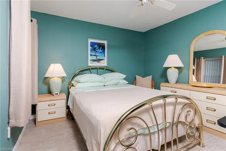 Bedroom featuring ceiling fan & walk-in closet