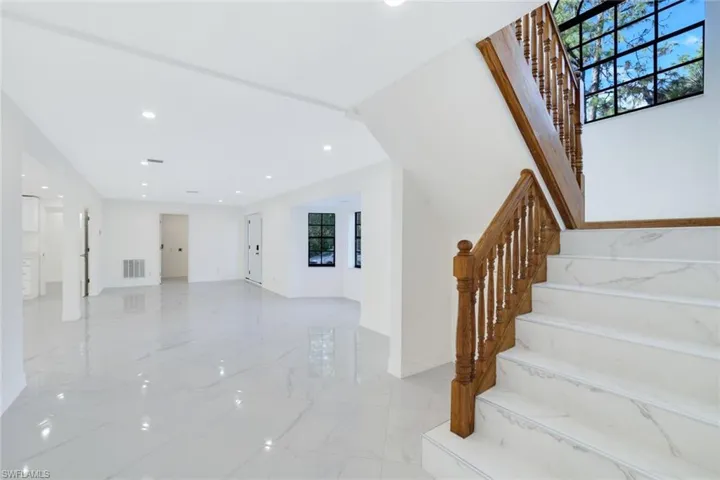 1st floor living room area with stairs to the 2nd floor