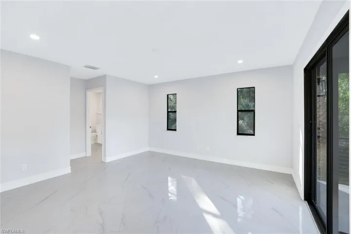 2nd floor bedroom featuring an attached bathroom