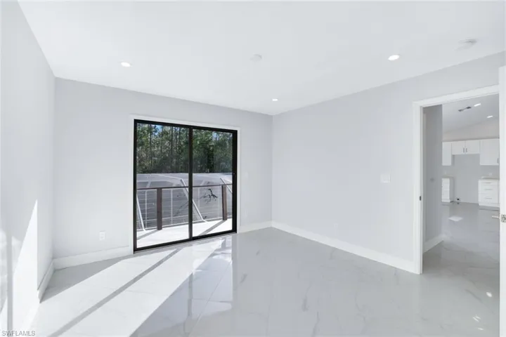 2nd floor room featuring sliding glass doors leading to the balcony