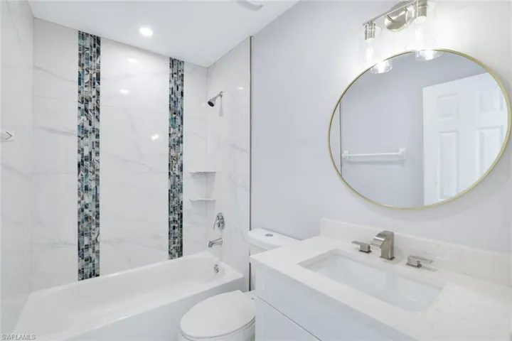 2nd floor bathroom with vanity, toilet, and tiled shower / bath tub