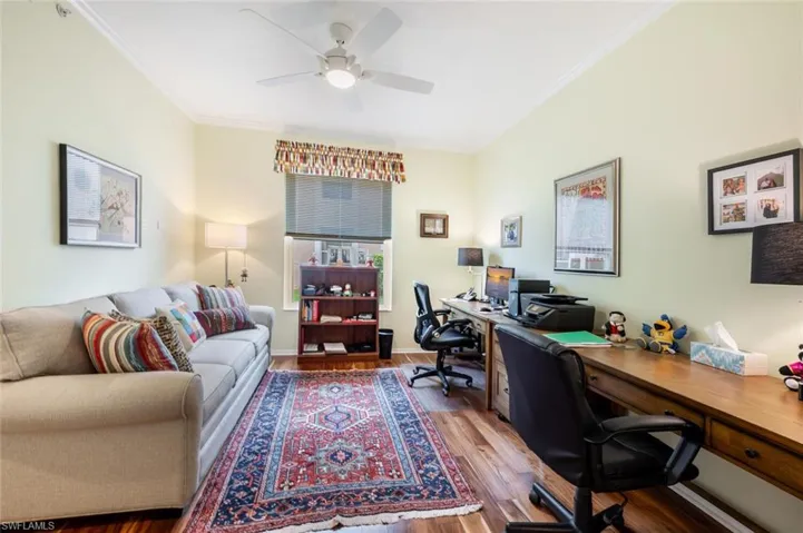 Home office featuring ornamental molding, hardwood / wood-style floors, and ceiling fan