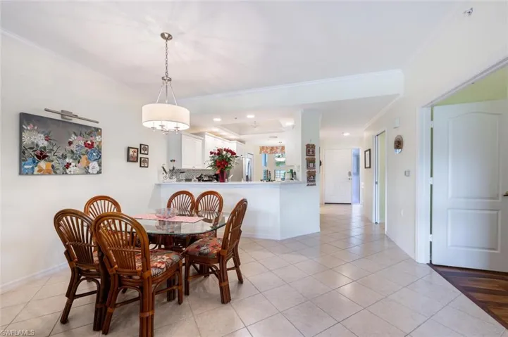 Tiled dining room with ornamental molding