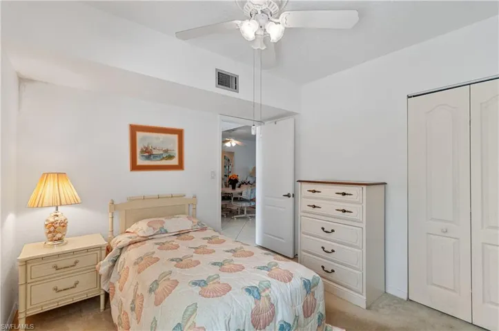 Bedroom featuring carpet, a closet, and ceiling fan