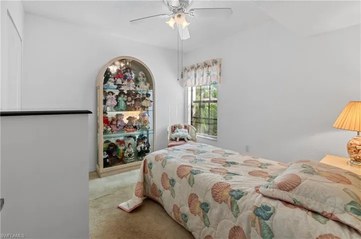 Bedroom featuring ceiling fan and carpet floors