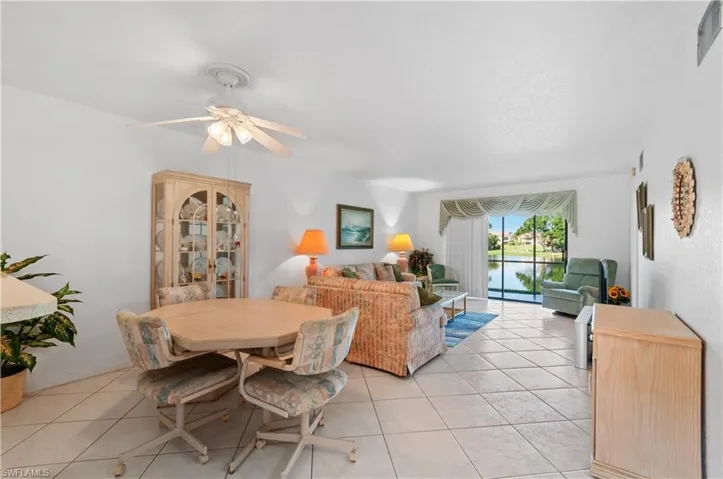 Tiled dining space with ceiling fan