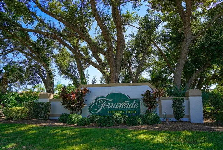 Community sign featuring a yard
