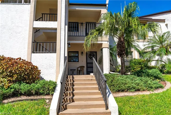 Entrance to property with a balcony