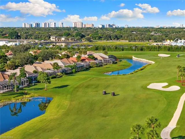 Bird's eye view of a nearby body of water and skyline