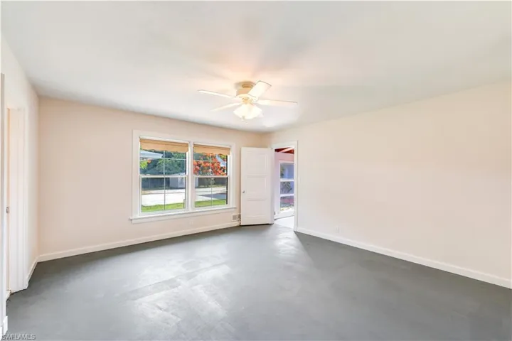Unfurnished room featuring ceiling fan