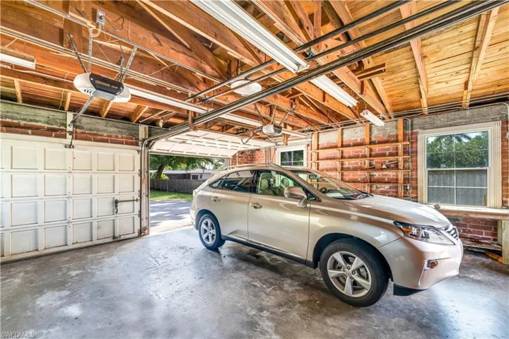 Garage featuring a garage door opener